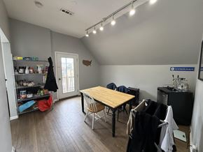 Chicago apartment for rent - A room with a table and chairs in it.