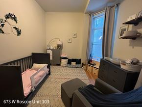 Chicago apartment for rent - A bedroom with a bed, dresser, and window.