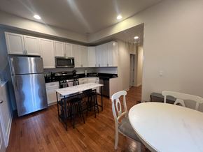 Chicago apartment for rent - A kitchen with a table and chairs.