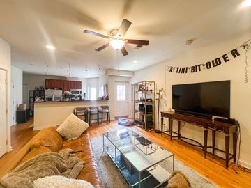 Chicago apartment for rent - A living room with a brown couch and a flat screen TV.
