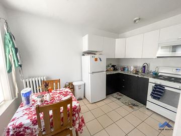 Evanston apartment for rent - a kitchen with a table and a refrigerator