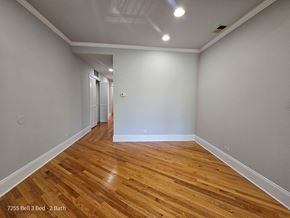 Chicago apartment for rent - a living room with a hard wood floor and grey walls