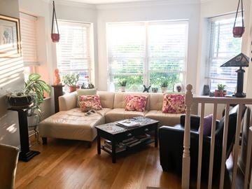 Evanston apartment for rent - A living room with a white couch and a coffee table.