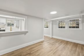 Denver apartment for rent - A room with wooden floors and white walls.