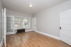Denver apartment for rent - A room with a window and a radiator on the floor.