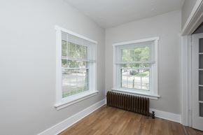 Denver apartment for rent - A room with a window and a radiator on the wall.