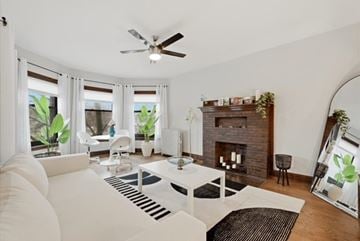 Evanston apartment for rent - A living room with a white couch and a fireplace.
