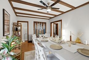 Evanston apartment for rent - A dining room with a long table set for a meal.
