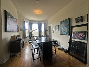 Chicago apartment for rent - A room with a table and chairs in it.