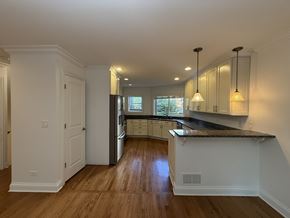 Winnetka townhouse for rent - A kitchen with a counter and cabinets.