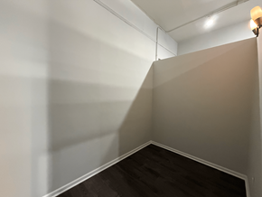 Chicago apartment for rent - A corner of a room with a light on.