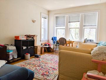 Chicago apartment for rent - a living room filled with furniture and a window