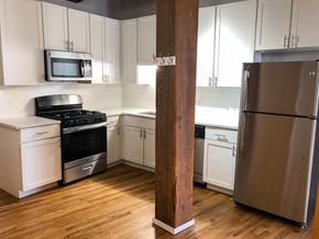Chicago apartment for rent - A kitchen with a refrigerator, stove, and oven.
