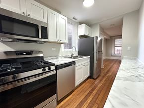 Chicago apartment for rent - A kitchen with a stove, oven, and refrigerator.
