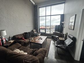 Chicago apartment for rent - A living room with a couch, chair, and coffee table.