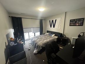 Chicago apartment for rent - A bedroom with a bed, desk, and chair.