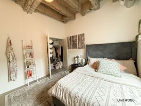 Chicago apartment for rent - A bedroom with a large bed and a wardrobe.