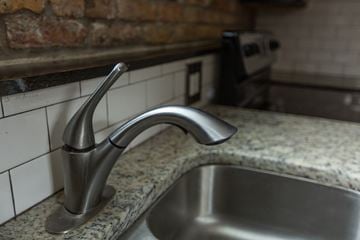 Chicago apartment for rent - A stainless steel kitchen sink with a chrome faucet.