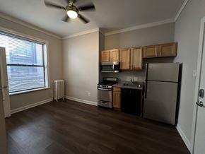 Chicago apartment for rent - A kitchen with a refrigerator, stove, and oven.