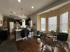 Chicago apartment for rent - A kitchen with a dining table and chairs.