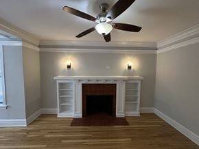 Chicago apartment for rent - A room with a fireplace and a ceiling fan.
