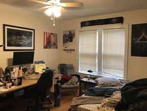Evanston apartment for rent - a bedroom with a desk and a bed and a window