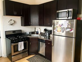 Chicago apartment for rent - A kitchen with a stainless steel refrigerator, oven, and dishwasher.