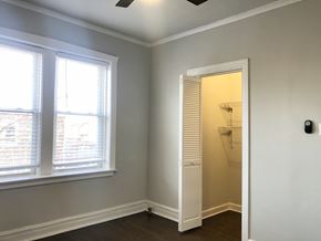 Chicago apartment for rent - A room with a window and a door.