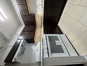 Chicago Il apartment for rent - A stainless steel oven with a glass door is in the foreground of the image.