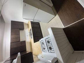 Chicago Il apartment for rent - A white stove top oven with a black back splash.