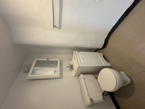 Chicago Il apartment for rent - A white toilet and sink in a small bathroom.