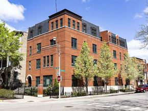 Chicago apartment for rent - A red brick building with a stop sign in front of it.