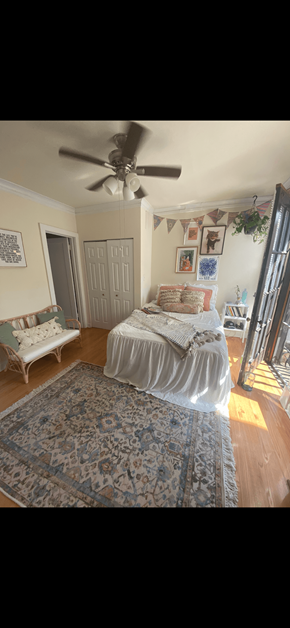 Chicago apartment for rent - a bedroom with a bed and a ceiling fan