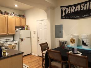 Chicago apartment for rent - A kitchen with a Thrash Skateboard Magazine on the wall.