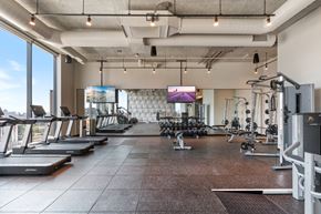 Chicago apartment for rent - a large fitness room with treadmills and other exercise equipment