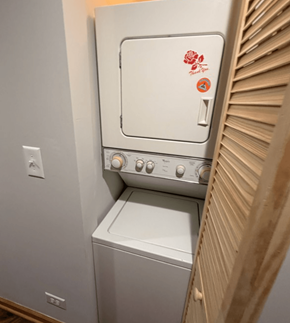 Chicago apartment for rent - A white oven with a red flower sticker on the door.