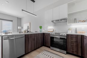 Cleveland apartment for rent - A modern kitchen with a stainless steel dishwasher and oven.