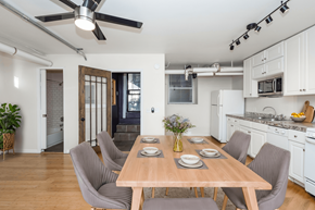 Denver apartment for rent - A dining room with a table set for four.