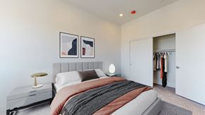 Denver apartment for rent - a bedroom with a bed and a closet