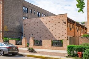 Chicago apartment for rent - the side of a brick building with a large shadow on it