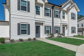 Oxford apartment for rent - a white house with green grass and a sidewalk