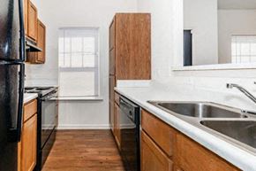 Oxford apartment for rent - a kitchen with a sink and a stove and a refrigerator