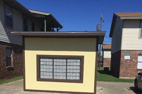 Baton Rouge apartment for rent - a yellow house with a window on the side of it
