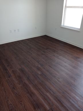 Bangs apartment for rent - an empty room with wooden floors and a window