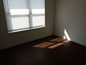 Bangs apartment for rent - an empty room with a window and wooden floors