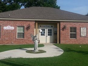 Lafayette apartment for rent - a statue of an angel in front of a brick building
