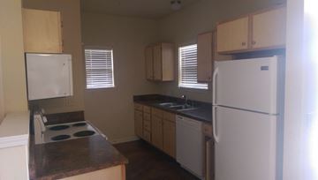 Lafayette apartment for rent - a kitchen with white appliances and white cabinets