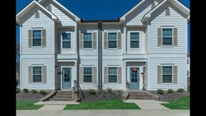 Oxford apartment for rent - a white house with blue doors and a lawn