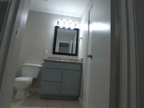 Baton Rouge apartment for rent - a bathroom with a toilet and a sink and a mirror