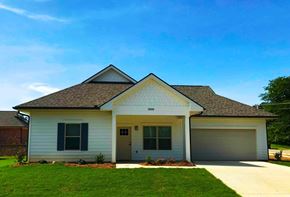 Tupelo apartment for rent - a white house with a lawn and a blue sky